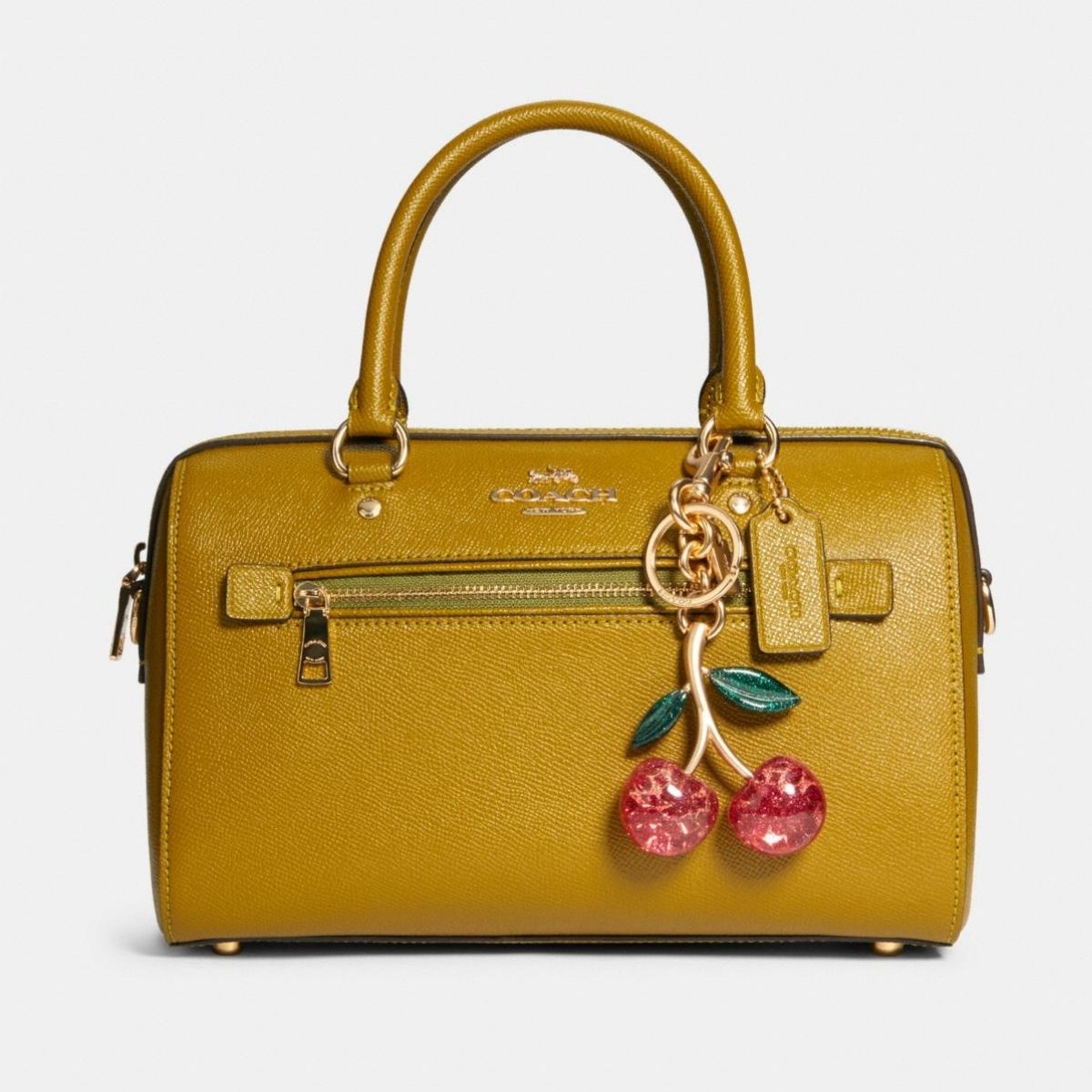 Elevate Your Style: The Coach Shoulder Bag with Cherry Charm